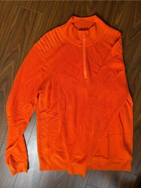 RLX Ralph Lauren performance full-zip sweater in a bold orange color